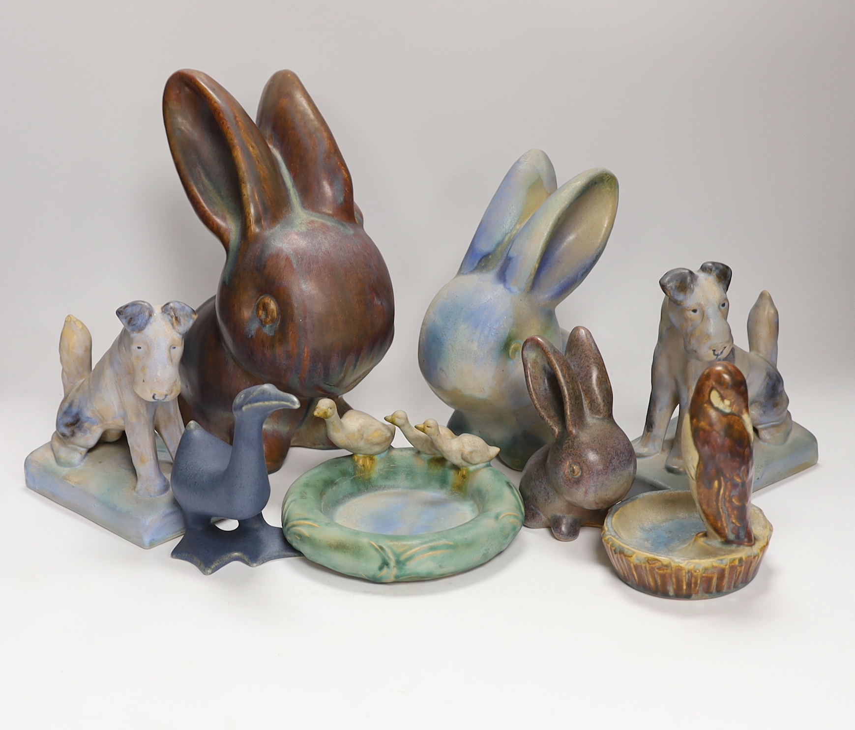 Collection of Bourne Denby animals including rabbits and a pair of dogs, tallest 27cm